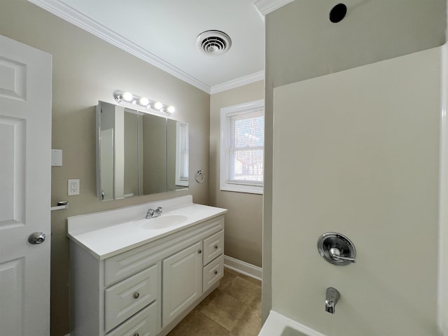 bathroom with crown molding, vanity, and tile patterned flooring