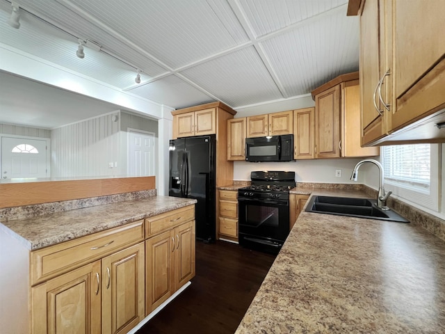 kitchen with track lighting, dark hardwood / wood-style flooring, sink, and black appliances