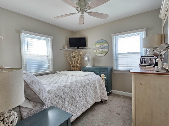 408 E 7th Ave, North Wildwood, NJ 08260 - bedroom featuring light colored carpet, multiple windows, baseboards, and a ceiling fan