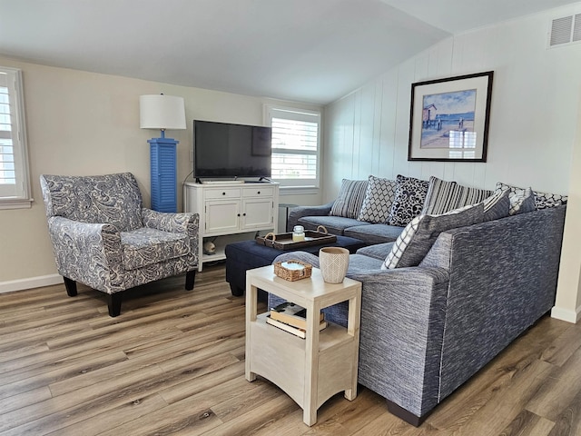 408 E 7th Ave, North Wildwood, NJ 08260 - living room featuring light wood-type flooring, lofted ceiling, visible vents, and baseboards