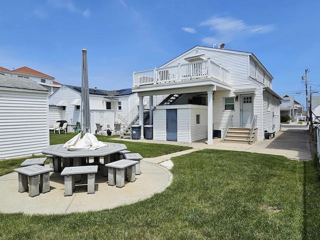 408 E 7th Ave, North Wildwood, NJ 08260 - rear view of house featuring a yard, entry steps, stairs, and a deck