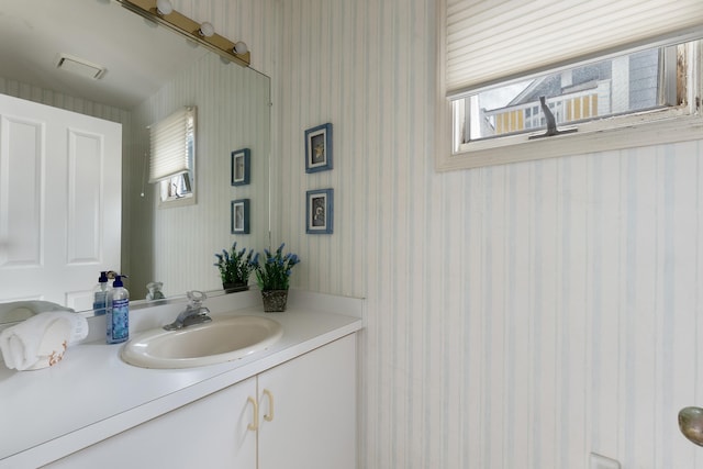 53 E 25th St, Avalon, NJ 08202 - bathroom with vanity, healthy amount of natural light, and wallpapered walls