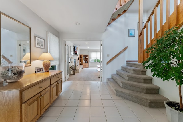53 E 25th St, Avalon, NJ 08202 - foyer entrance featuring light carpet, stairway, light tile patterned floors, and recessed lighting