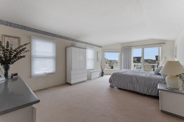 53 E 25th St, Avalon, NJ 08202 - bedroom featuring a textured ceiling, light carpet, and access to outside
