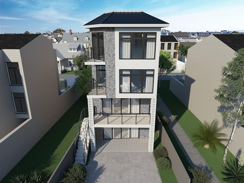 233 W 17th St, Ocean City, NJ 08226 - rear view of house with a balcony, stucco siding, metal roof, and a standing seam roof