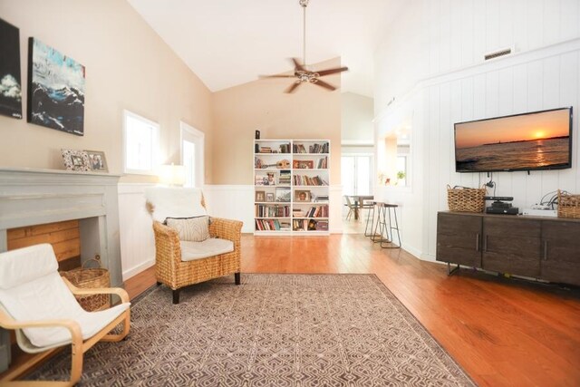 14 Freedom Dr, Erma, NJ 08204 - sitting room featuring wood finished floors, a fireplace, ceiling fan, healthy amount of natural light, and high vaulted ceiling