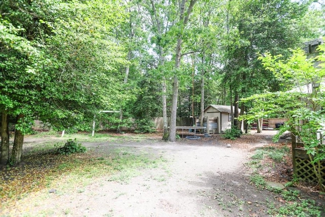 14 Freedom Dr, Erma, NJ 08204 - view of yard with an outdoor structure, fence, and a storage unit