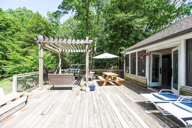 14 Freedom Dr, Erma, NJ 08204 - deck featuring outdoor dining area, a pergola, a sunroom, and view of scattered trees