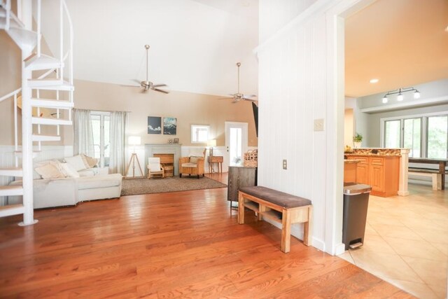 14 Freedom Dr, Erma, NJ 08204 - living area with a ceiling fan, high vaulted ceiling, a fireplace, and light wood finished floors