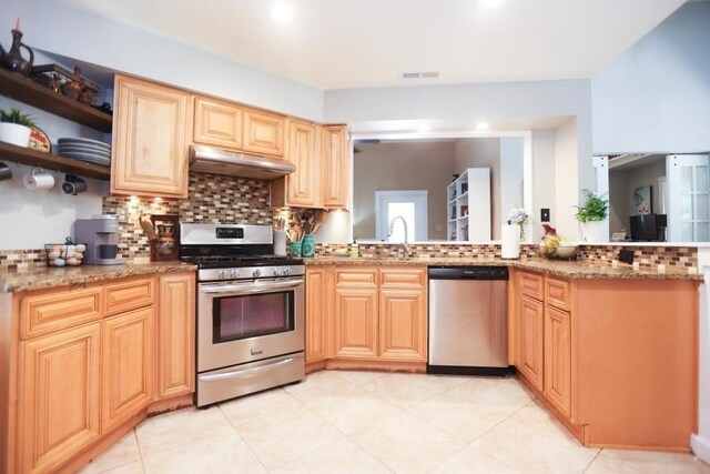 14 Freedom Dr, Erma, NJ 08204 - kitchen featuring appliances with stainless steel finishes, under cabinet range hood, decorative backsplash, a sink, and light stone counters
