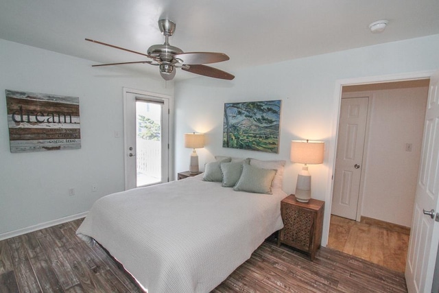 bedroom featuring access to exterior, ceiling fan, and dark hardwood / wood-style flooring