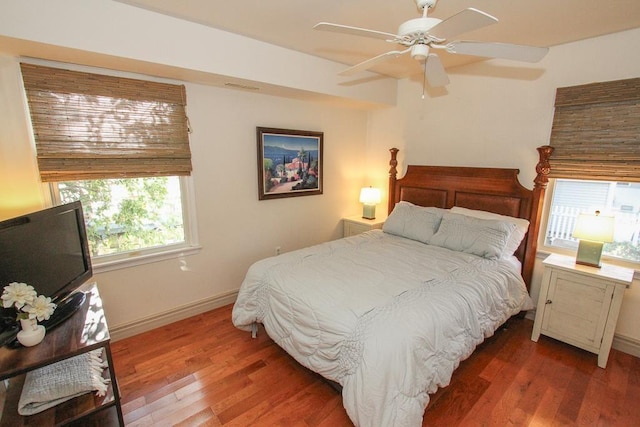 bedroom featuring dark hardwood / wood-style flooring and ceiling fan