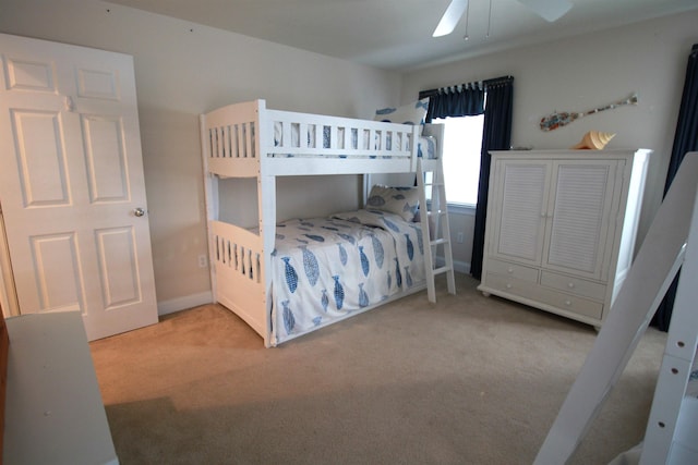 bedroom featuring light carpet and ceiling fan