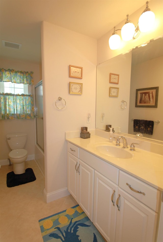 full bathroom with tile patterned flooring, vanity, toilet, and shower / bath combination with glass door