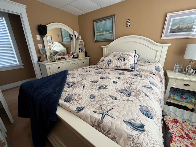 bedroom featuring baseboards