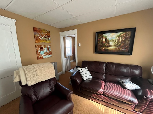 living area featuring baseboards