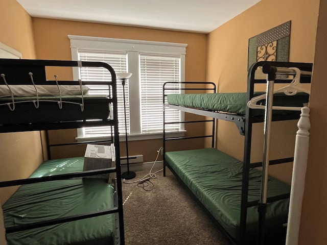 bedroom with carpet flooring and baseboard heating