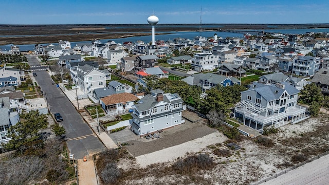 bird's eye view with a residential view and a water view