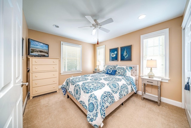 bedroom featuring light carpet, baseboards, a ceiling fan, and recessed lighting