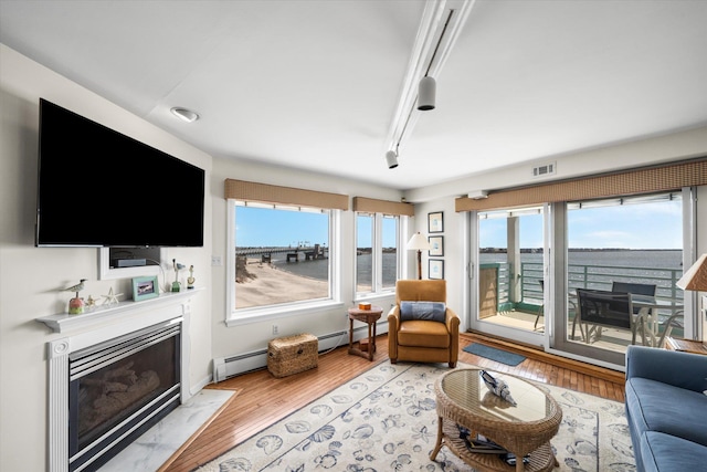 9400 Roberts Ave Unit 306, Sea Isle City, NJ 08243 - living room with a fireplace with flush hearth and light wood finished floors
