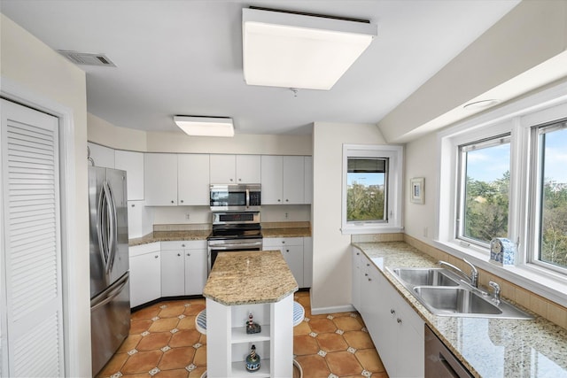 9400 Roberts Ave Unit 306, Sea Isle City, NJ 08243 - kitchen with stainless steel appliances, a sink, open shelves, and plenty of natural light