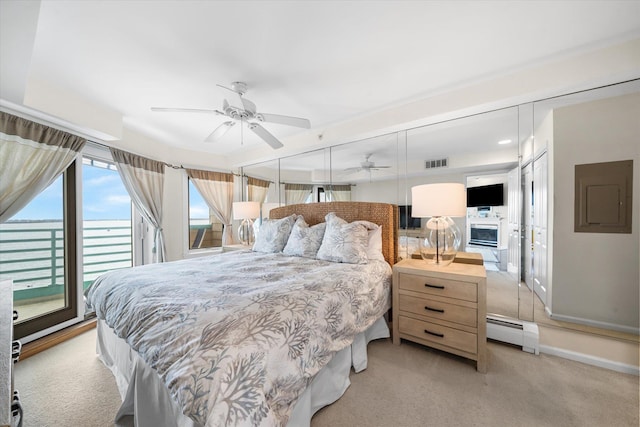 9400 Roberts Ave Unit 306, Sea Isle City, NJ 08243 - bedroom featuring a baseboard heating unit, light carpet, electric panel, access to outside, and baseboards