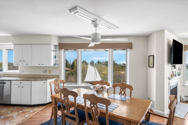 9400 Roberts Ave Unit 306, Sea Isle City, NJ 08243 - dining area featuring ceiling fan, healthy amount of natural light, and a baseboard heating unit