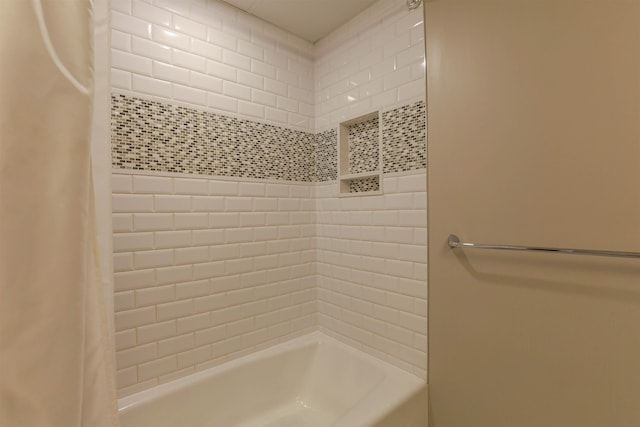 bathroom featuring shower / tub combo with curtain