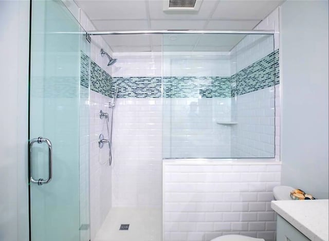 bathroom with an enclosed shower and vanity