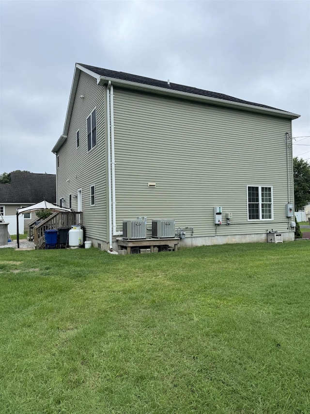 view of property exterior with a lawn