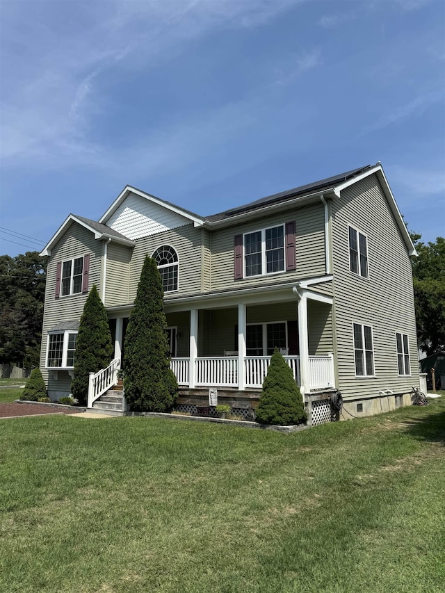 view of front of property with a front lawn and a porch