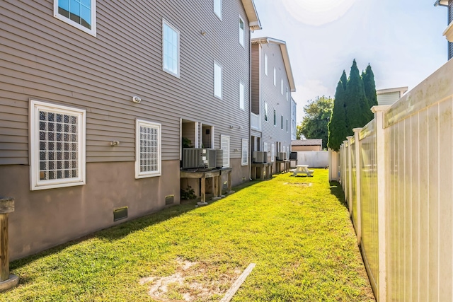 view of yard with central AC unit