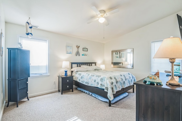 bedroom featuring ceiling fan, light carpet, and vaulted ceiling