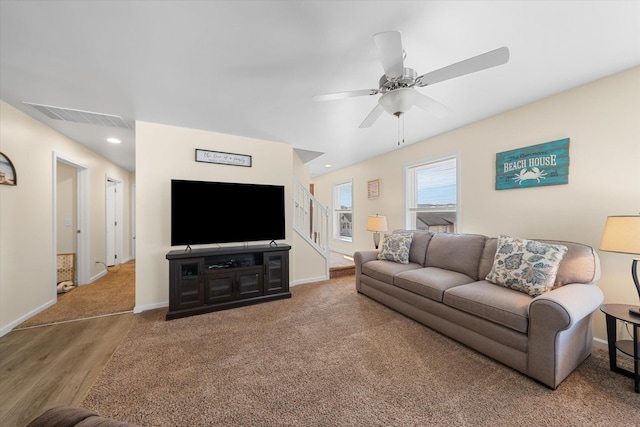 living room with ceiling fan and hardwood / wood-style flooring