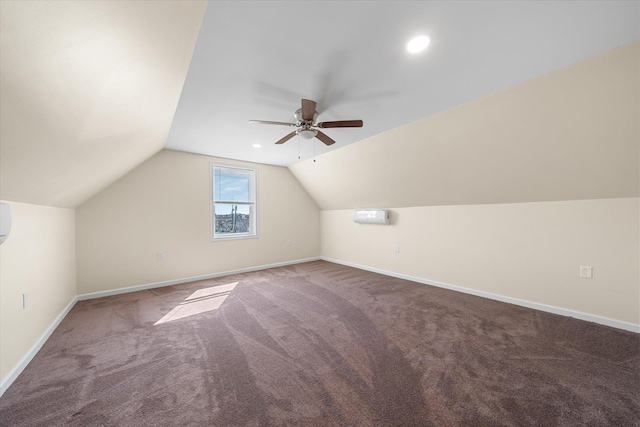 bonus room with carpet flooring, ceiling fan, a wall mounted air conditioner, and lofted ceiling