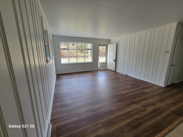 empty room featuring dark hardwood / wood-style flooring