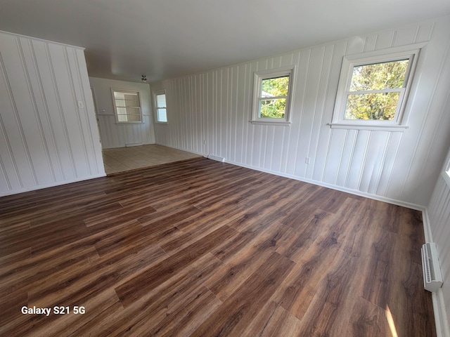 spare room featuring dark hardwood / wood-style floors