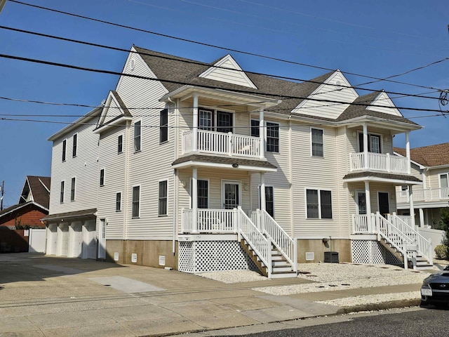 134 E Sweetbriar Rd Unit 134, Wildwood Crest, NJ 08260 - view of front facade featuring a balcony and roof with shingles