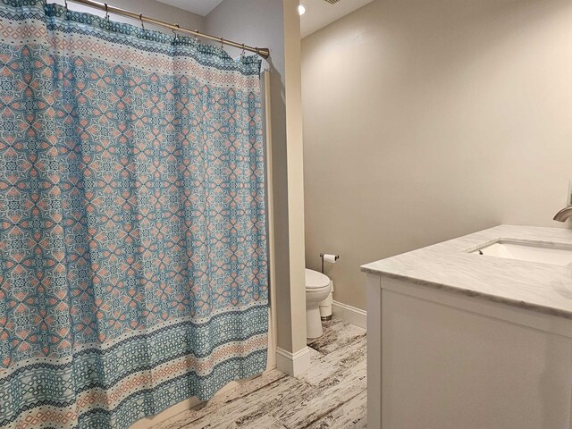134 E Sweetbriar Rd Unit 134, Wildwood Crest, NJ 08260 - full bath with vanity, wood finished floors, and a shower with curtain