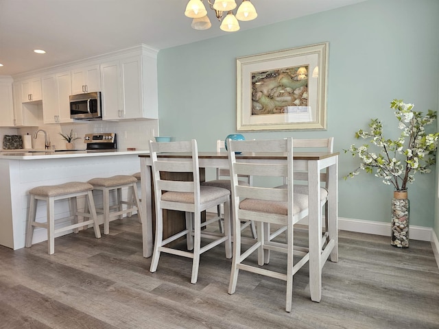 134 E Sweetbriar Rd Unit 134, Wildwood Crest, NJ 08260 - dining room with a chandelier, light wood finished floors, and recessed lighting