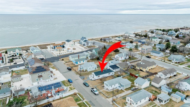 bird's eye view with a residential view and a water view