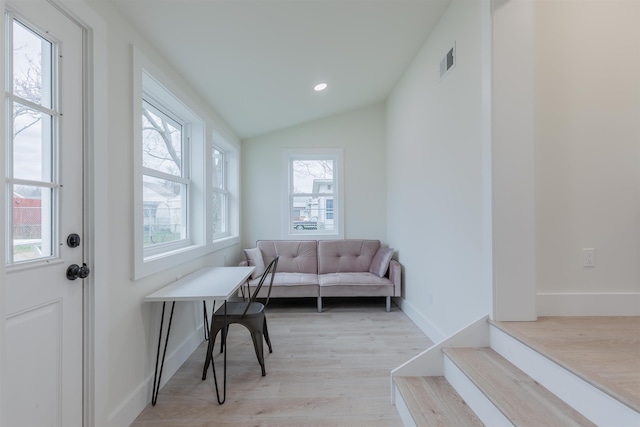 sitting room with lofted ceiling, recessed lighting, visible vents, baseboards, and light wood-type flooring