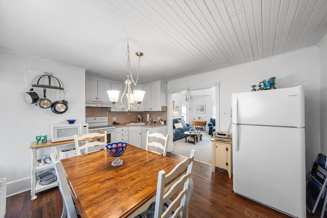 2090 Rte 50, Tuckahoe, NJ 08270 - dining room with dark wood-style floors and an inviting chandelier