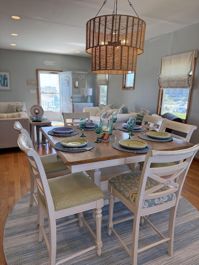 dining area with wood finished floors
