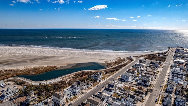 drone / aerial view with a view of the beach and a water view