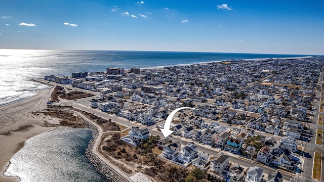 aerial view with a view of the beach and a water view