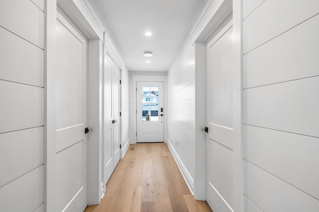 hall with recessed lighting and light wood-style floors