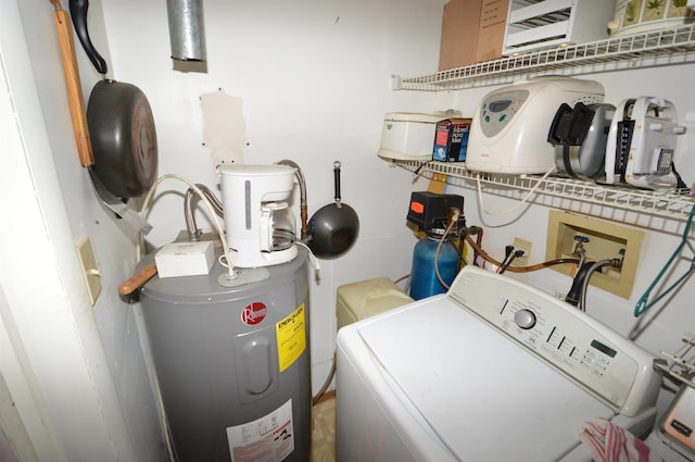 clothes washing area with water heater and washer / dryer