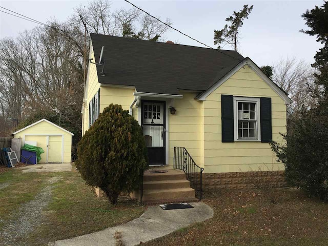 view of front facade featuring a storage shed