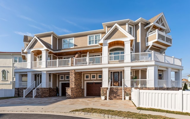 407 Paradise Way Unit 1, North Wildwood, NJ 08260 - view of front of house featuring stone siding, driveway, and a garage